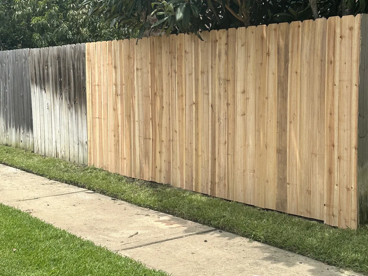 New wood section replacing a damaged stretch of privacy fence, privacy fence repair