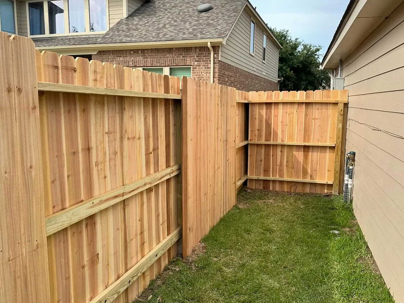 Replaced wood privacy fence along a side yard, privacy fence repair