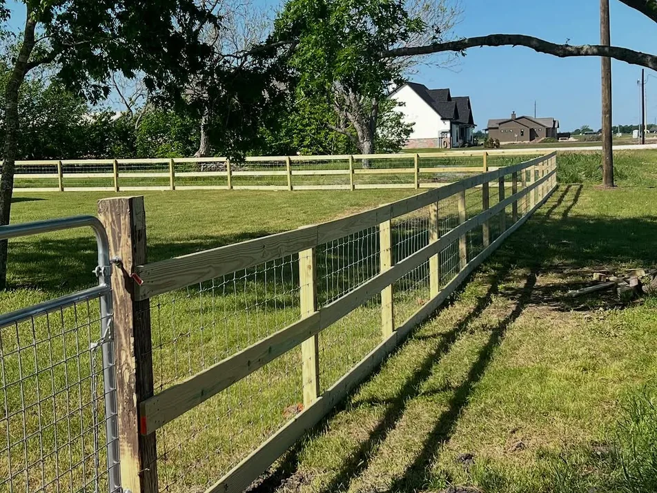 Wood post and wire fence with a gate, ranch fencing